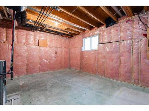 8-249 Ross Avenue, Cochrane, AB - Indoor Photo Showing Basement