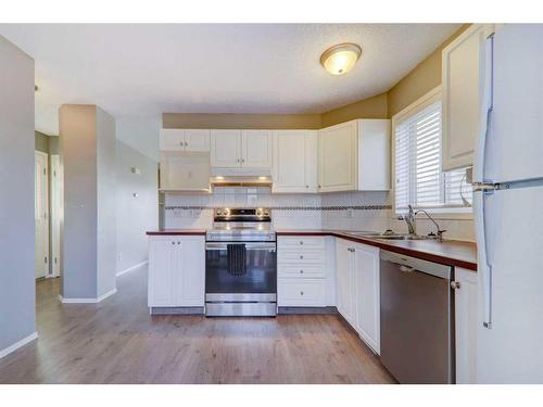 2048 Country Hills Circle Nw, Calgary, AB - Indoor Photo Showing Kitchen With Double Sink