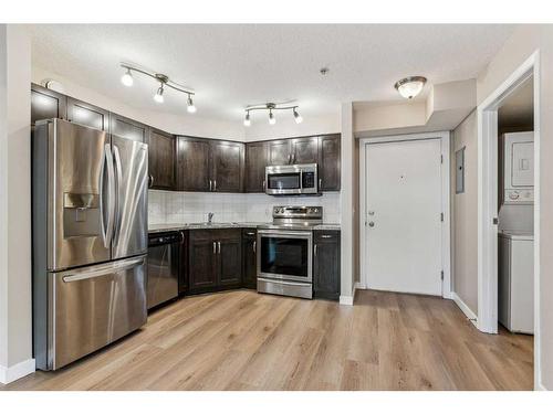 107-2000 Applevillage Court Se, Calgary, AB - Indoor Photo Showing Kitchen With Stainless Steel Kitchen