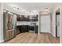 107-2000 Applevillage Court Se, Calgary, AB  - Indoor Photo Showing Kitchen With Stainless Steel Kitchen 