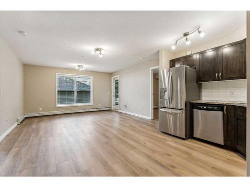 107-2000 Applevillage Court Se, Calgary, AB - Indoor Photo Showing Kitchen With Stainless Steel Kitchen