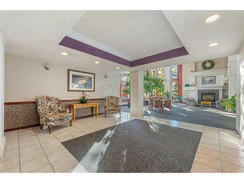 227-1920 14 Avenue Ne, Calgary, AB - Indoor With Fireplace