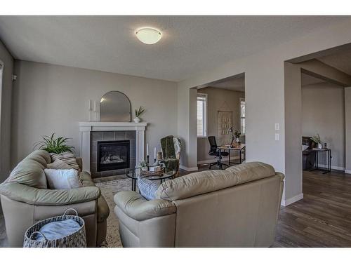 100 Sage Bluff Close Nw, Calgary, AB - Indoor Photo Showing Living Room With Fireplace