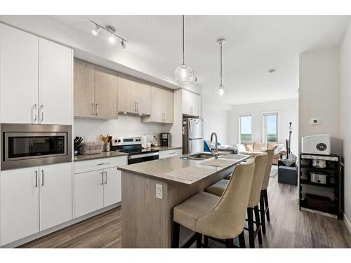 614-238 Sage Valley Common Nw, Calgary, AB - Indoor Photo Showing Kitchen With Double Sink With Upgraded Kitchen