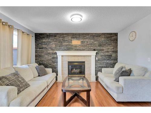 111 Chaparral Ridge Circle Se, Calgary, AB - Indoor Photo Showing Living Room With Fireplace