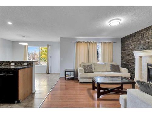 111 Chaparral Ridge Circle Se, Calgary, AB - Indoor Photo Showing Living Room With Fireplace