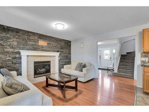 111 Chaparral Ridge Circle Se, Calgary, AB - Indoor Photo Showing Living Room With Fireplace