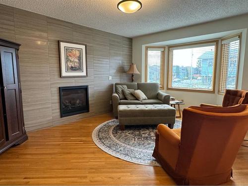 20 Ventura Road Ne, Calgary, AB - Indoor Photo Showing Living Room With Fireplace