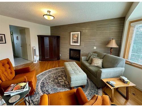 20 Ventura Road Ne, Calgary, AB - Indoor Photo Showing Living Room With Fireplace