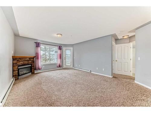 312-345 Rocky Vista Park Nw, Calgary, AB - Indoor With Fireplace