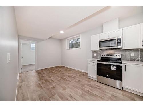 134 Wolf Creek Park Se, Calgary, AB - Indoor Photo Showing Kitchen