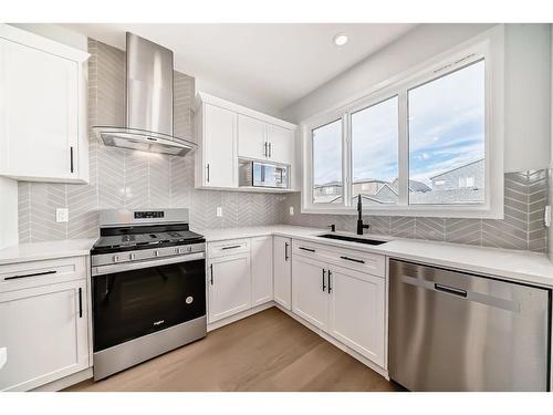 134 Wolf Creek Park Se, Calgary, AB - Indoor Photo Showing Kitchen With Upgraded Kitchen