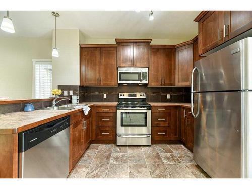 263 Ranch Ridge Meadow, Strathmore, AB - Indoor Photo Showing Kitchen With Stainless Steel Kitchen With Double Sink