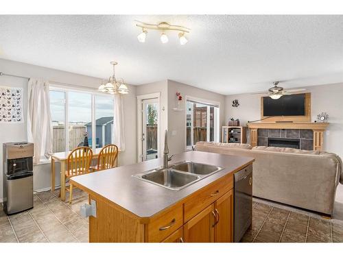 121 Saddlecrest Way Ne, Calgary, AB - Indoor Photo Showing Other Room With Fireplace