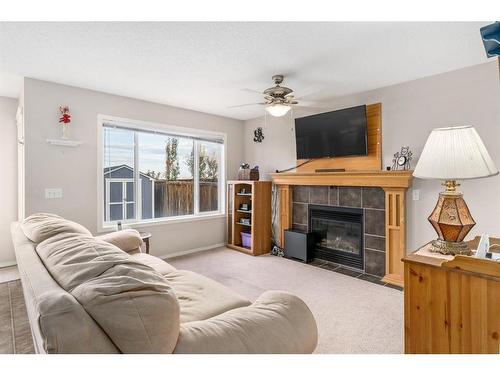 121 Saddlecrest Way Ne, Calgary, AB - Indoor Photo Showing Living Room With Fireplace