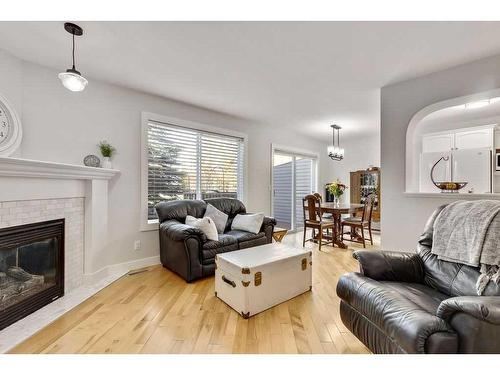 7-117 Bow Ridge Drive, Cochrane, AB - Indoor Photo Showing Living Room With Fireplace