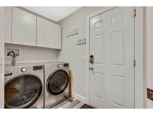 7-117 Bow Ridge Drive, Cochrane, AB - Indoor Photo Showing Laundry Room