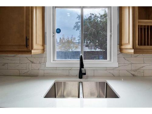 115 Bracewood Way Sw, Calgary, AB - Indoor Photo Showing Kitchen With Double Sink