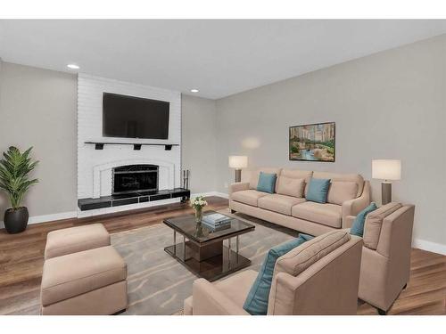 115 Bracewood Way Sw, Calgary, AB - Indoor Photo Showing Living Room With Fireplace