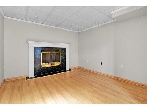 115 Bracewood Way Sw, Calgary, AB - Indoor With Fireplace