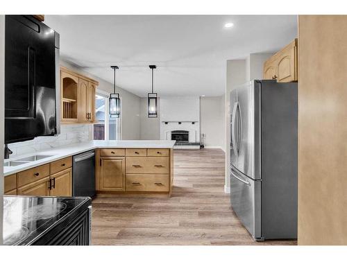 115 Bracewood Way Sw, Calgary, AB - Indoor Photo Showing Kitchen With Double Sink