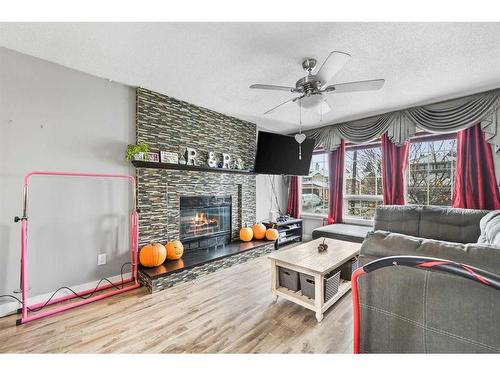 48 Sandpiper Way Nw, Calgary, AB - Indoor Photo Showing Living Room With Fireplace