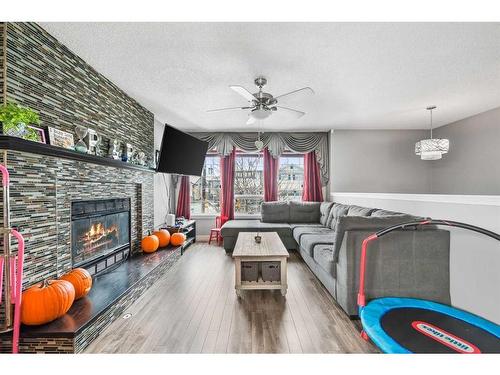 48 Sandpiper Way Nw, Calgary, AB - Indoor Photo Showing Living Room With Fireplace