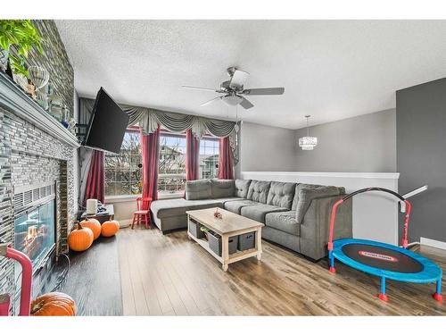 48 Sandpiper Way Nw, Calgary, AB - Indoor Photo Showing Living Room With Fireplace