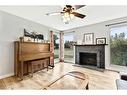 112 Hodson Crescent, Okotoks, AB  - Indoor Photo Showing Living Room With Fireplace 