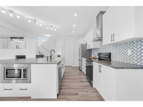 801 Windrow Green Sw, Airdrie, AB - Indoor Photo Showing Kitchen With Upgraded Kitchen