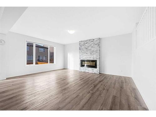 801 Windrow Green Sw, Airdrie, AB - Indoor Photo Showing Living Room With Fireplace