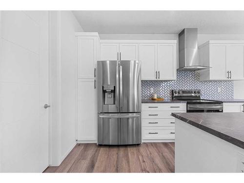 801 Windrow Green Sw, Airdrie, AB - Indoor Photo Showing Kitchen With Stainless Steel Kitchen With Upgraded Kitchen