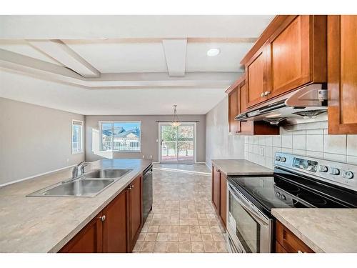 178 Panatella Boulevard Nw, Calgary, AB - Indoor Photo Showing Kitchen With Double Sink