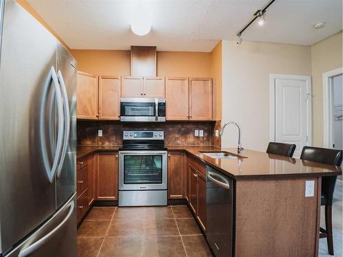 233-52 Cranfield Link Se, Calgary, AB - Indoor Photo Showing Kitchen With Double Sink