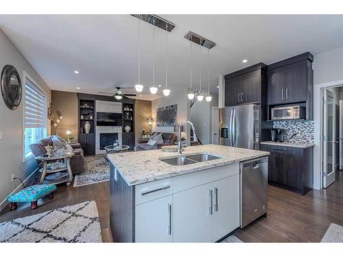 14 Baysprings Terrace Sw, Airdrie, AB - Indoor Photo Showing Kitchen With Double Sink With Upgraded Kitchen