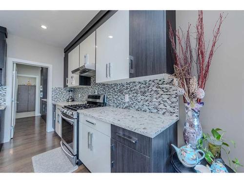 14 Baysprings Terrace Sw, Airdrie, AB - Indoor Photo Showing Kitchen With Upgraded Kitchen