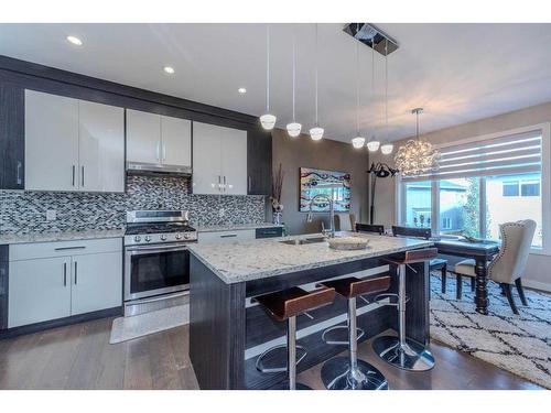 14 Baysprings Terrace Sw, Airdrie, AB - Indoor Photo Showing Kitchen With Double Sink With Upgraded Kitchen