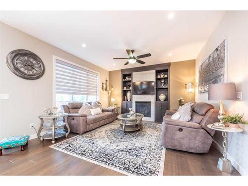 14 Baysprings Terrace Sw, Airdrie, AB - Indoor Photo Showing Living Room With Fireplace