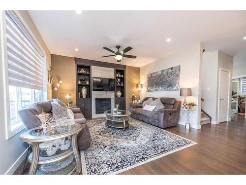 14 Baysprings Terrace Sw, Airdrie, AB - Indoor Photo Showing Living Room With Fireplace