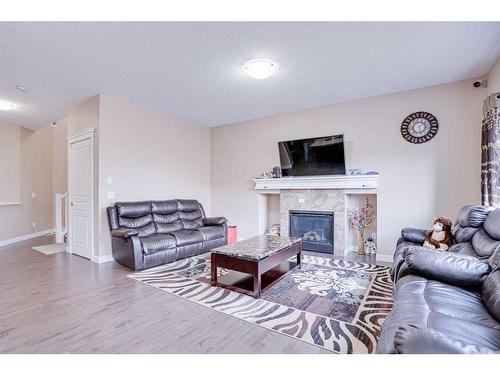 56 Red Embers Sq Ne Square West, Calgary, AB - Indoor Photo Showing Living Room With Fireplace