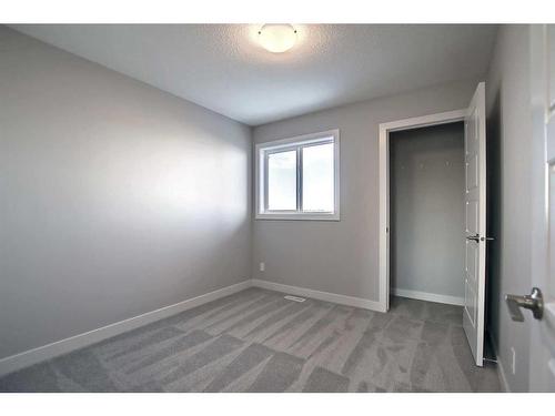 310 Sundown Road, Cochrane, AB - Indoor Photo Showing Other Room