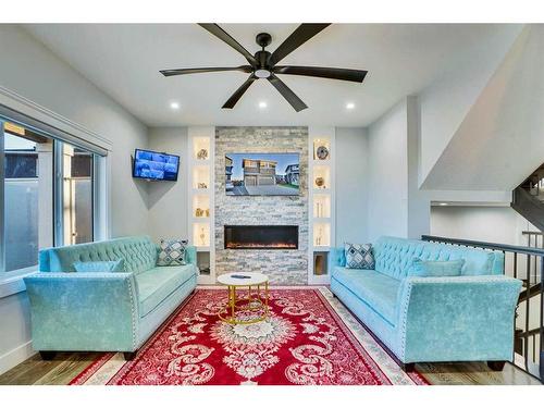 22 Chelsea Bay, Chestermere, AB - Indoor Photo Showing Living Room With Fireplace