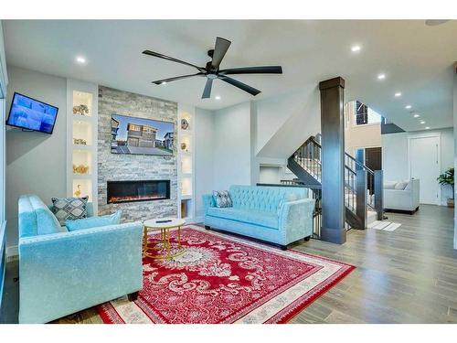 22 Chelsea Bay, Chestermere, AB - Indoor Photo Showing Living Room With Fireplace