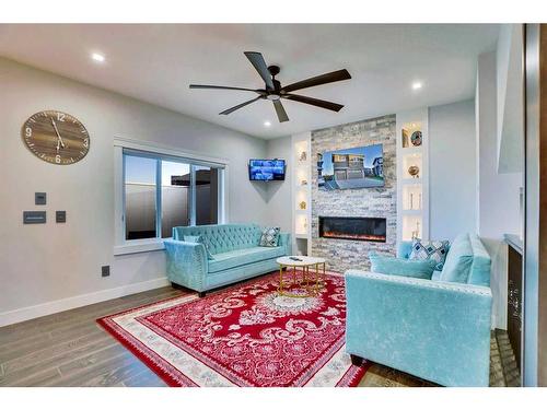 22 Chelsea Bay, Chestermere, AB - Indoor Photo Showing Living Room With Fireplace