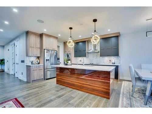 22 Chelsea Bay, Chestermere, AB - Indoor Photo Showing Kitchen With Upgraded Kitchen