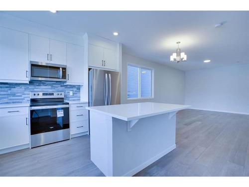 221 Chelsea Place Close, Chestermere, AB - Indoor Photo Showing Kitchen With Upgraded Kitchen