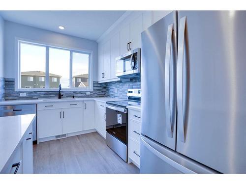 221 Chelsea Place Close, Chestermere, AB - Indoor Photo Showing Kitchen With Upgraded Kitchen