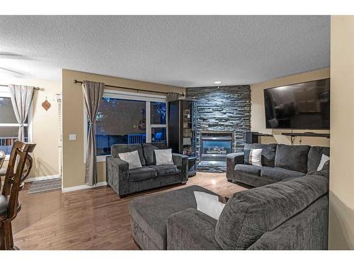 826 Copperfield Boulevard Se, Calgary, AB - Indoor Photo Showing Living Room With Fireplace