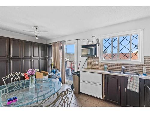 6128 Madigan Drive Ne, Calgary, AB - Indoor Photo Showing Kitchen With Double Sink