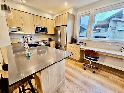 202I-209 Stewart Creek Rise, Canmore, AB - Indoor Photo Showing Kitchen With Stainless Steel Kitchen